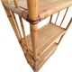Bamboo and wicker bookshelf, vintage boho-chic from the '70s.
