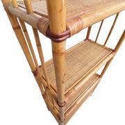 Bamboo and wicker bookshelf, vintage boho-chic from the '70s.