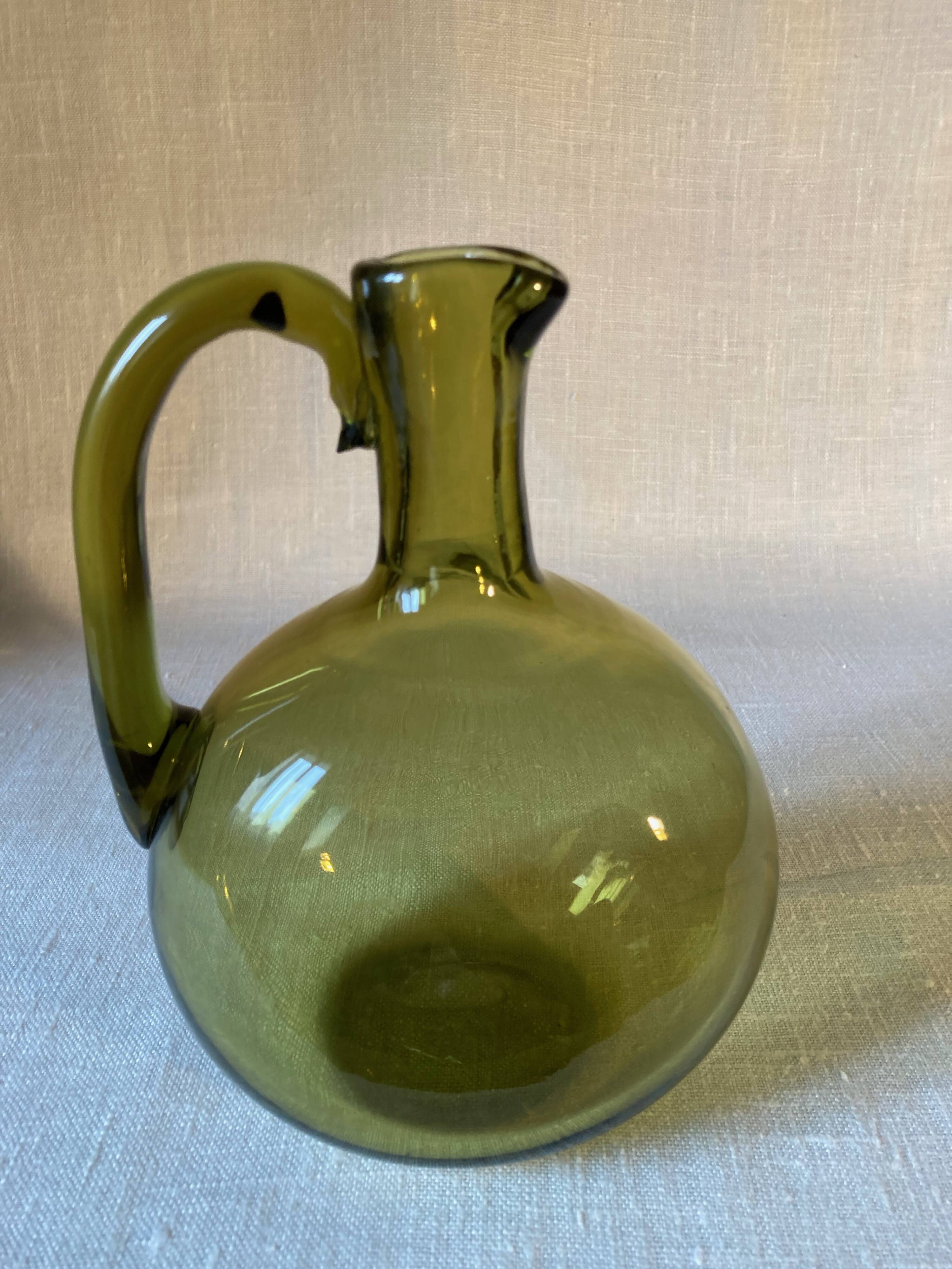 Green blown glass carafe