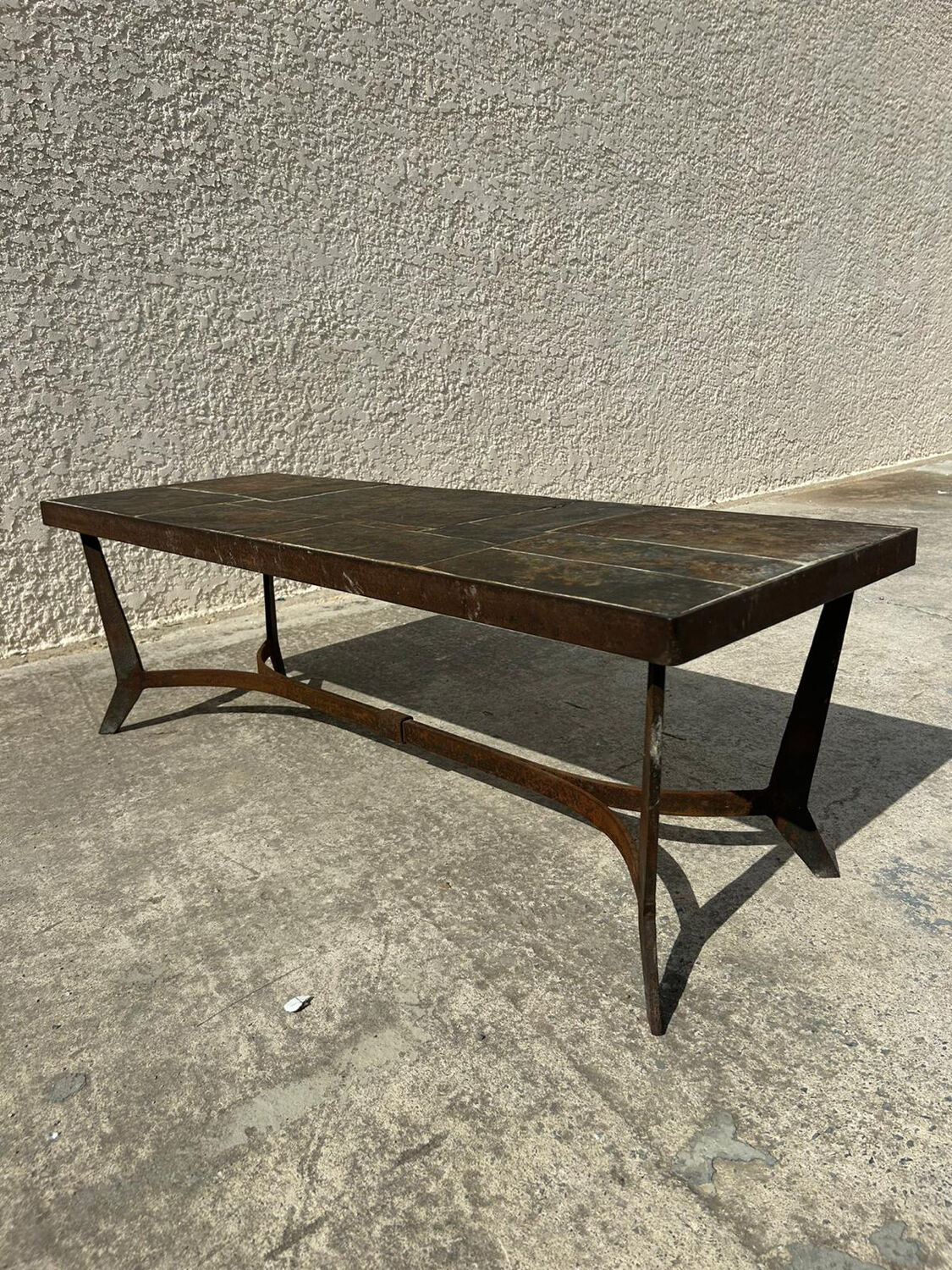 Coffee table with stone top and iron legs
