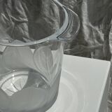 Glass ice or champagne bucket with stylized petal patterns