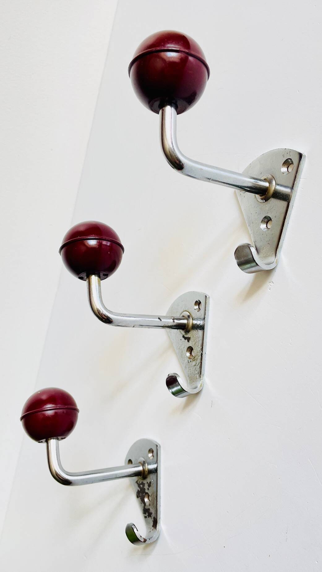 Chrome and bakelite coat hooks from the 70s