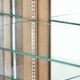 Antique Dutch oak display cabinet with glass shelves and a mirrored back