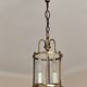 Cylindrical brass and glass lantern in Louis XVI style.