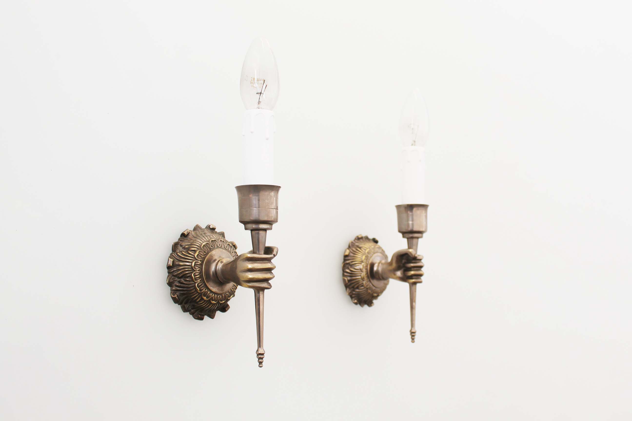 Pair of 1950’s solid metal ‘torch holding hand’ wall sconces by maison arlus