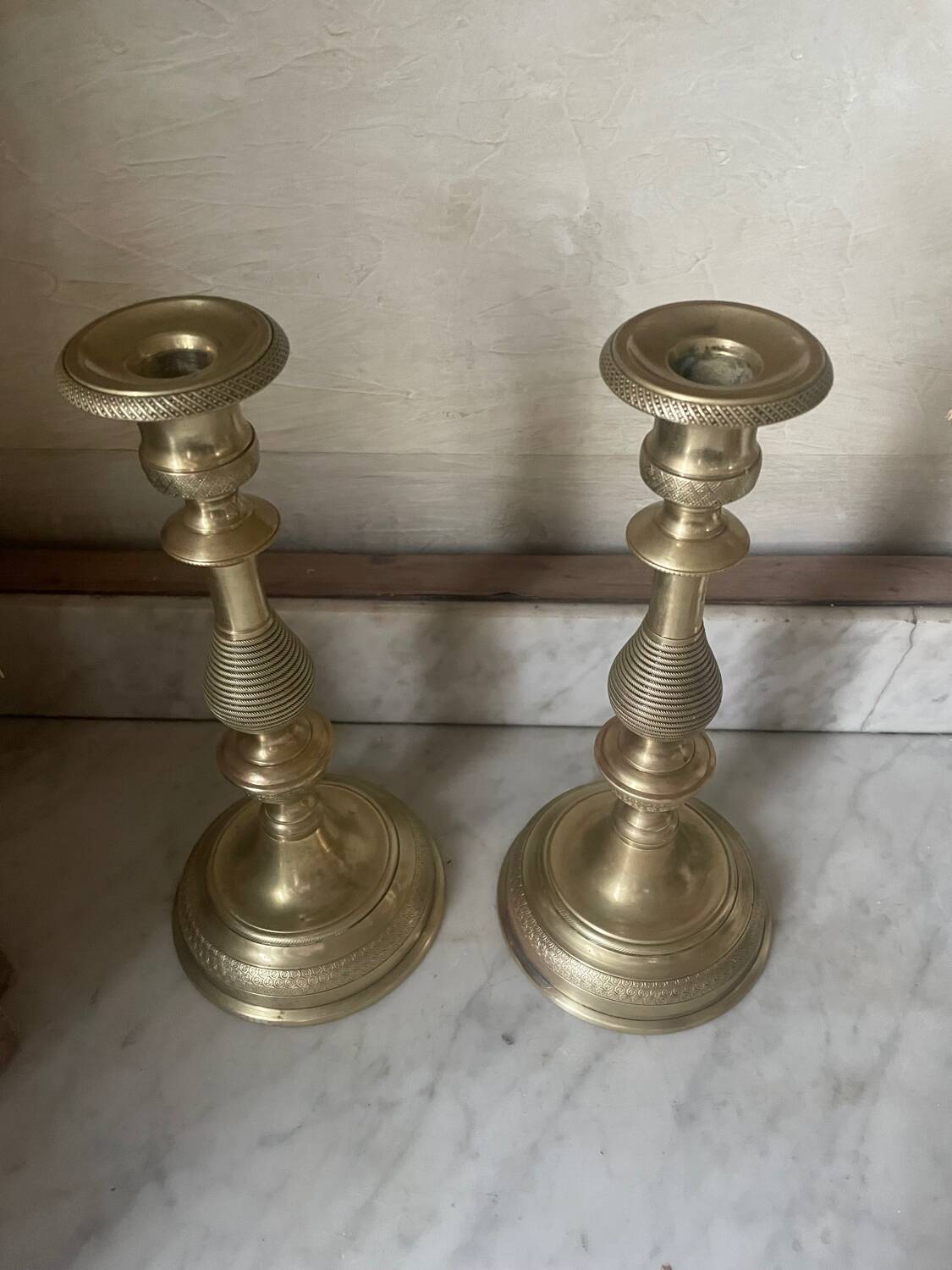 Antique pair of gilded bronze candlesticks