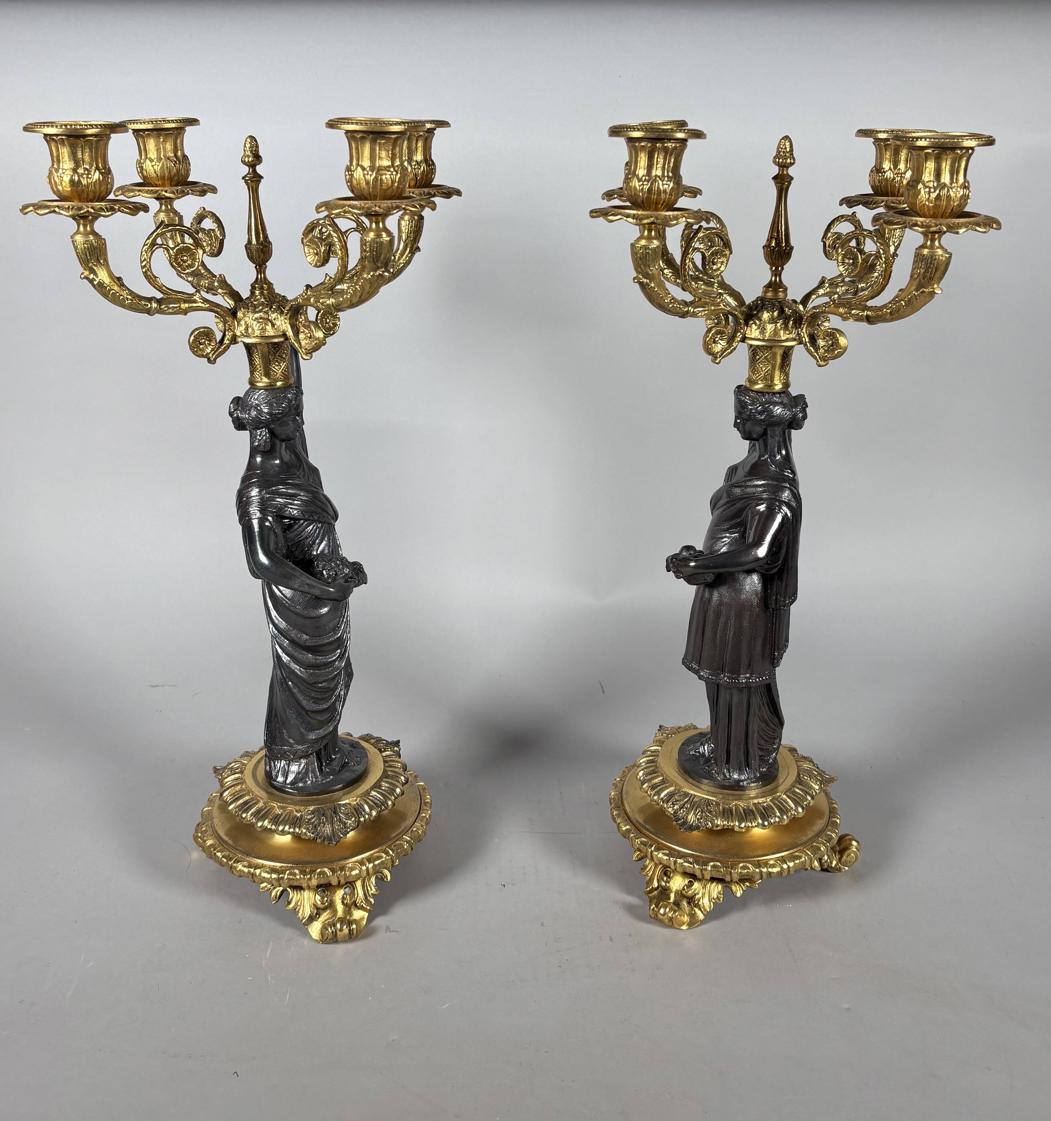 Pair of candelabra with women in the antique style of Napoleon III.
