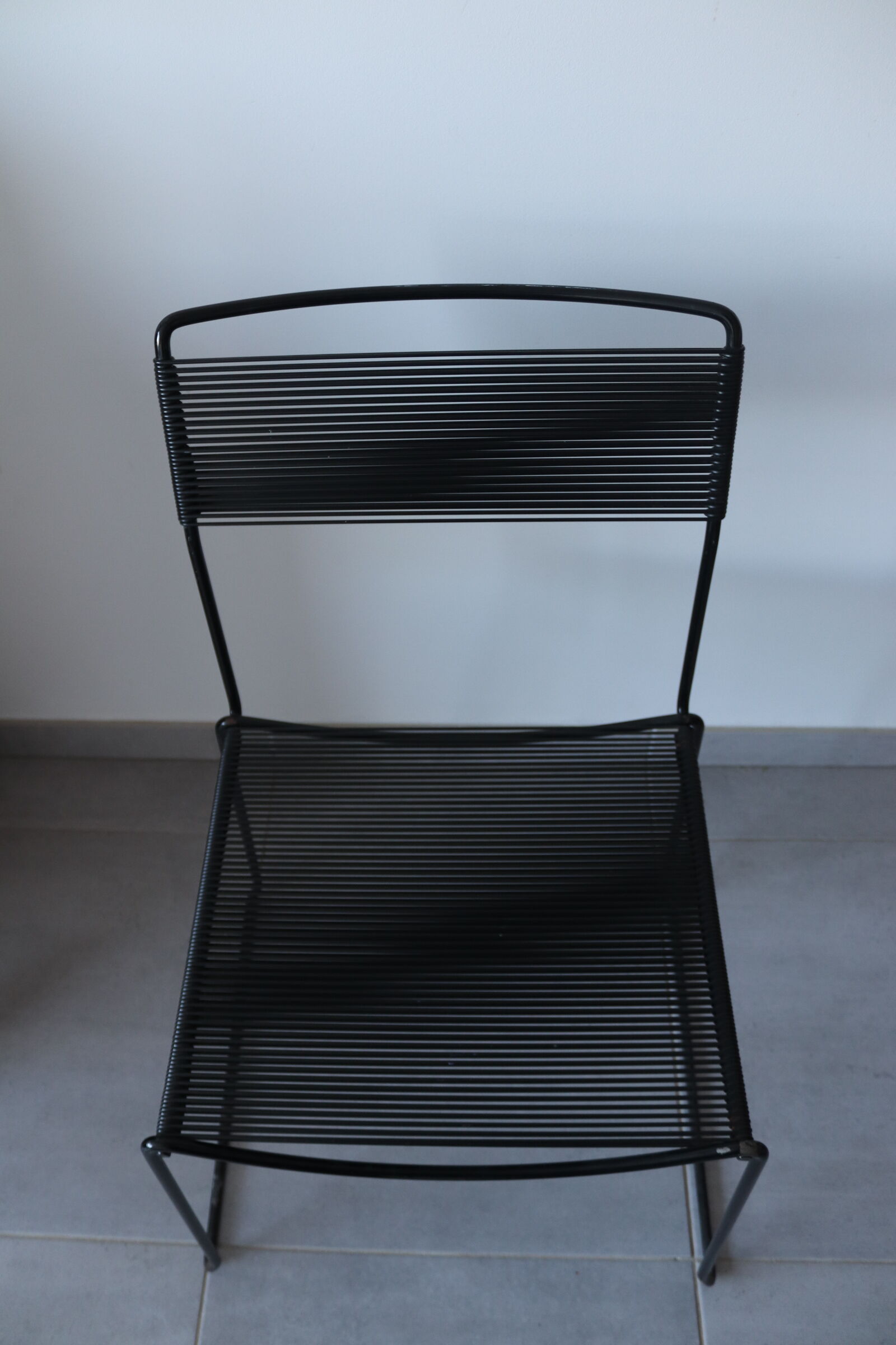 Black chair Spaghetti Giandomenico Belotti for fly line