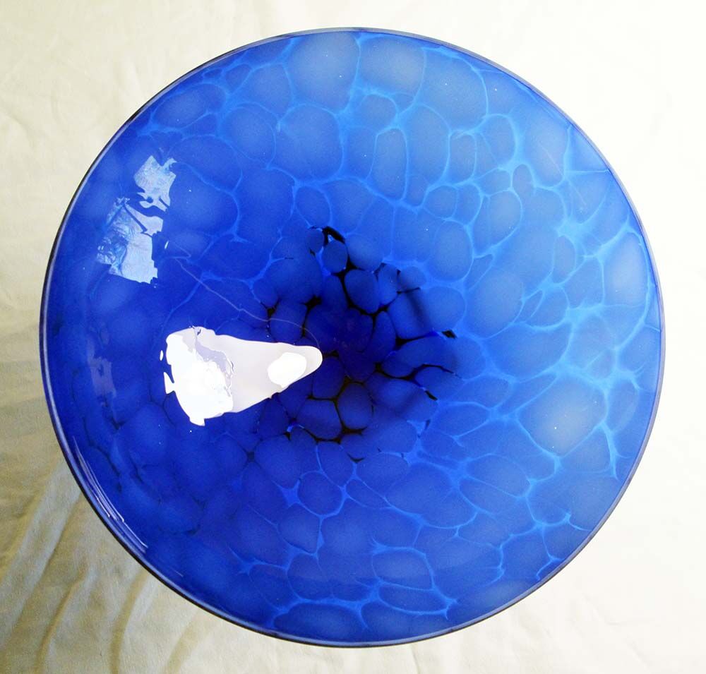 Blue glass cup on foot