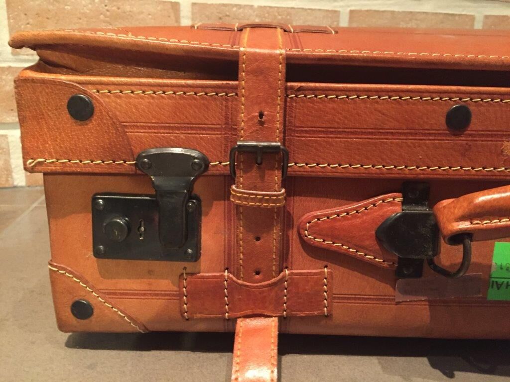 Thick leather suitcase