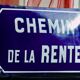 Old Enamelled and bulging "Chemin de la Rente" street plate, in perfect condition, on its cast iron support