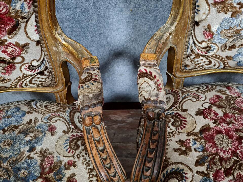 Pair of Louis XV style Baroque armchairs in gilded and carved wood circa 1900
