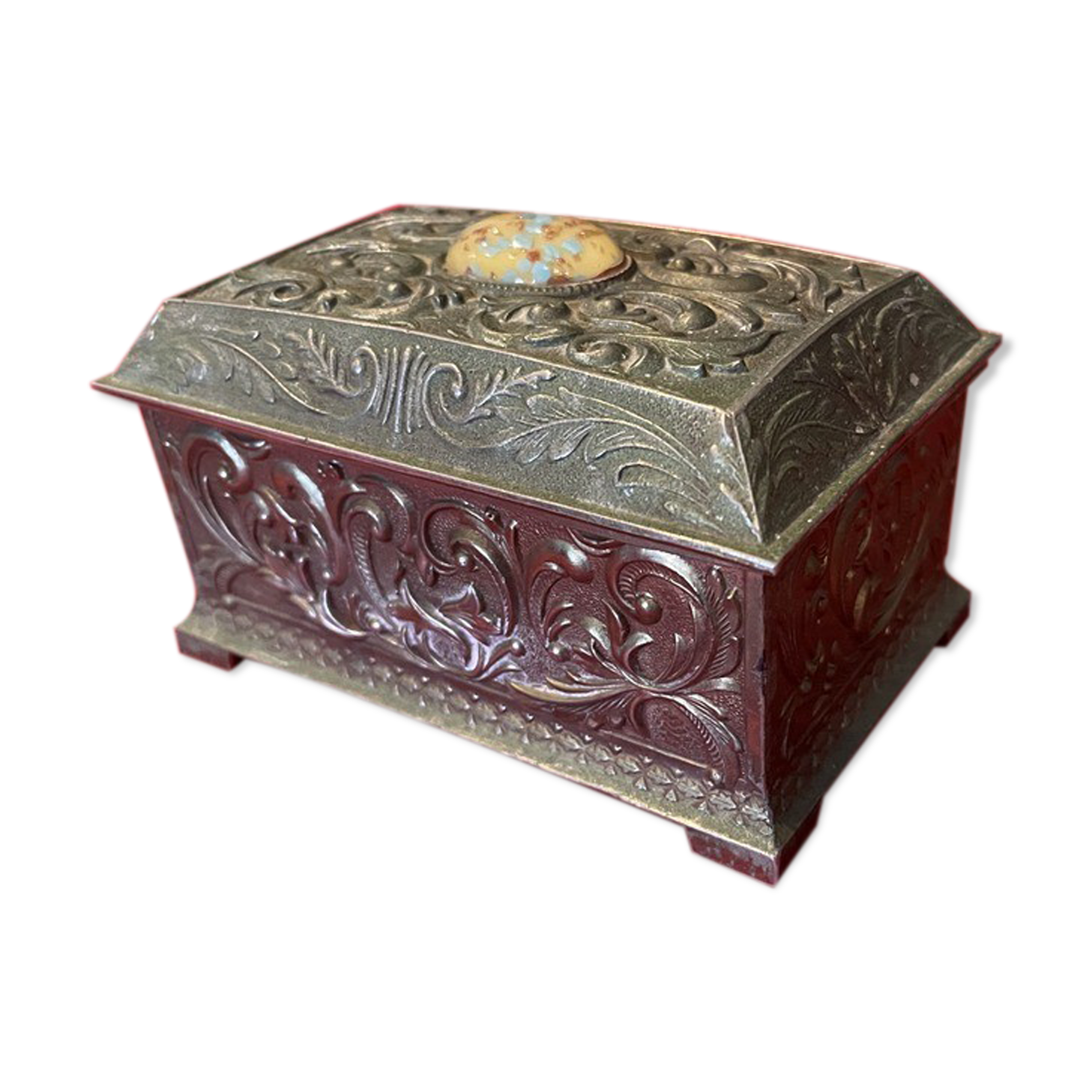 Ancient box made of chiseled metal and stone