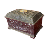 Ancient box made of chiseled metal and stone