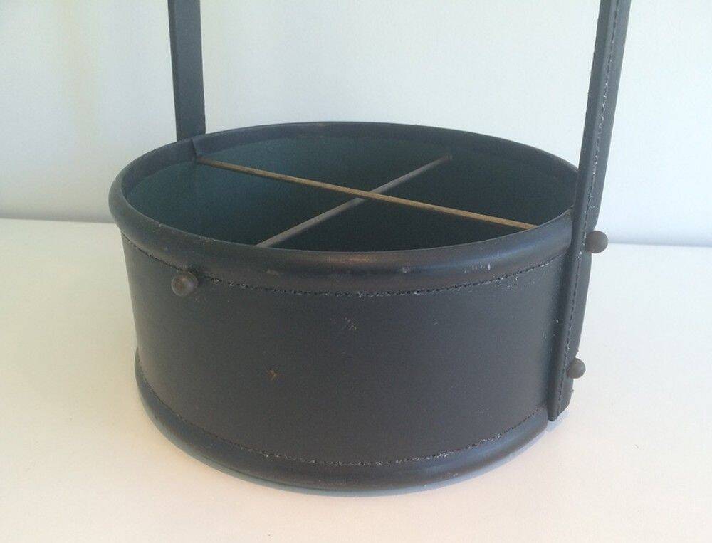 Leather wall magazine rack. In the style of Jacques Adnet.