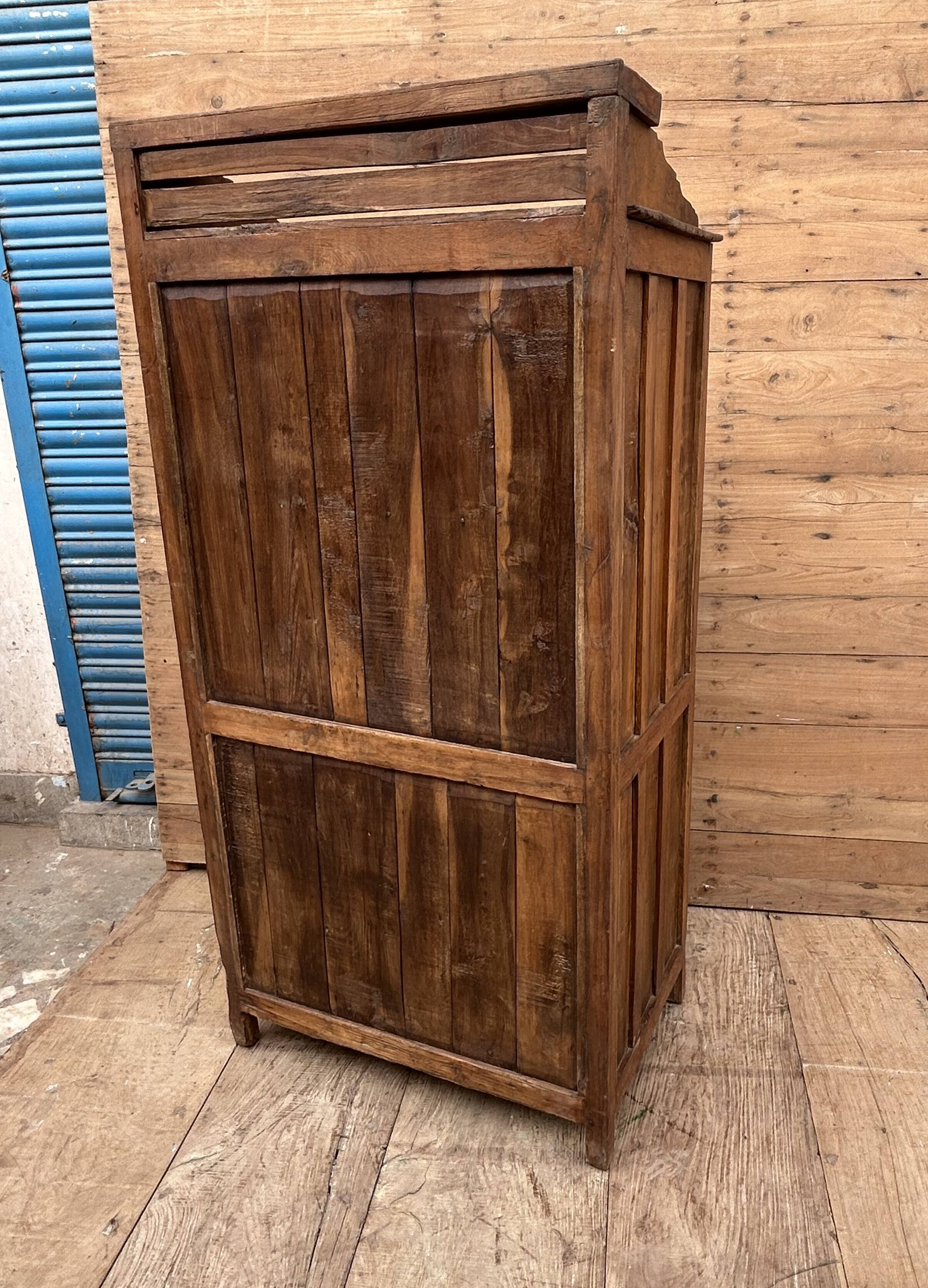 Art Deco glass-fronted cabinet in Burmese teak with original patina.