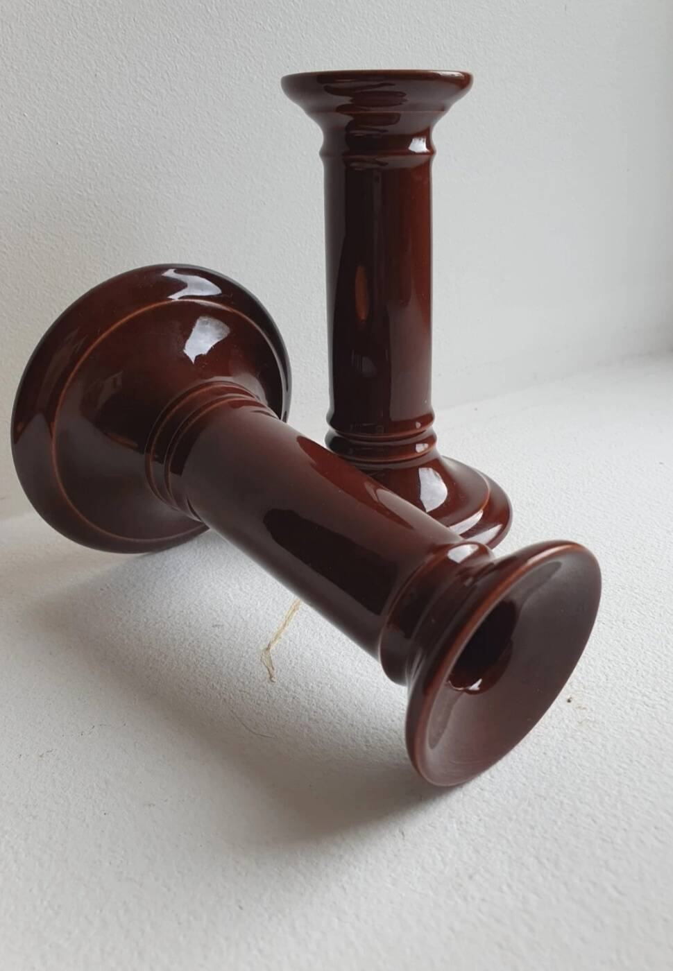 Pair of English brown ceramic candlesticks. Circa 2003, designed by S.