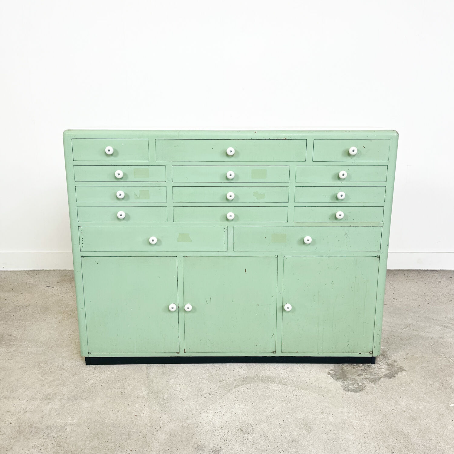 Vintage mint green dentist drawer unit with opaline glass top