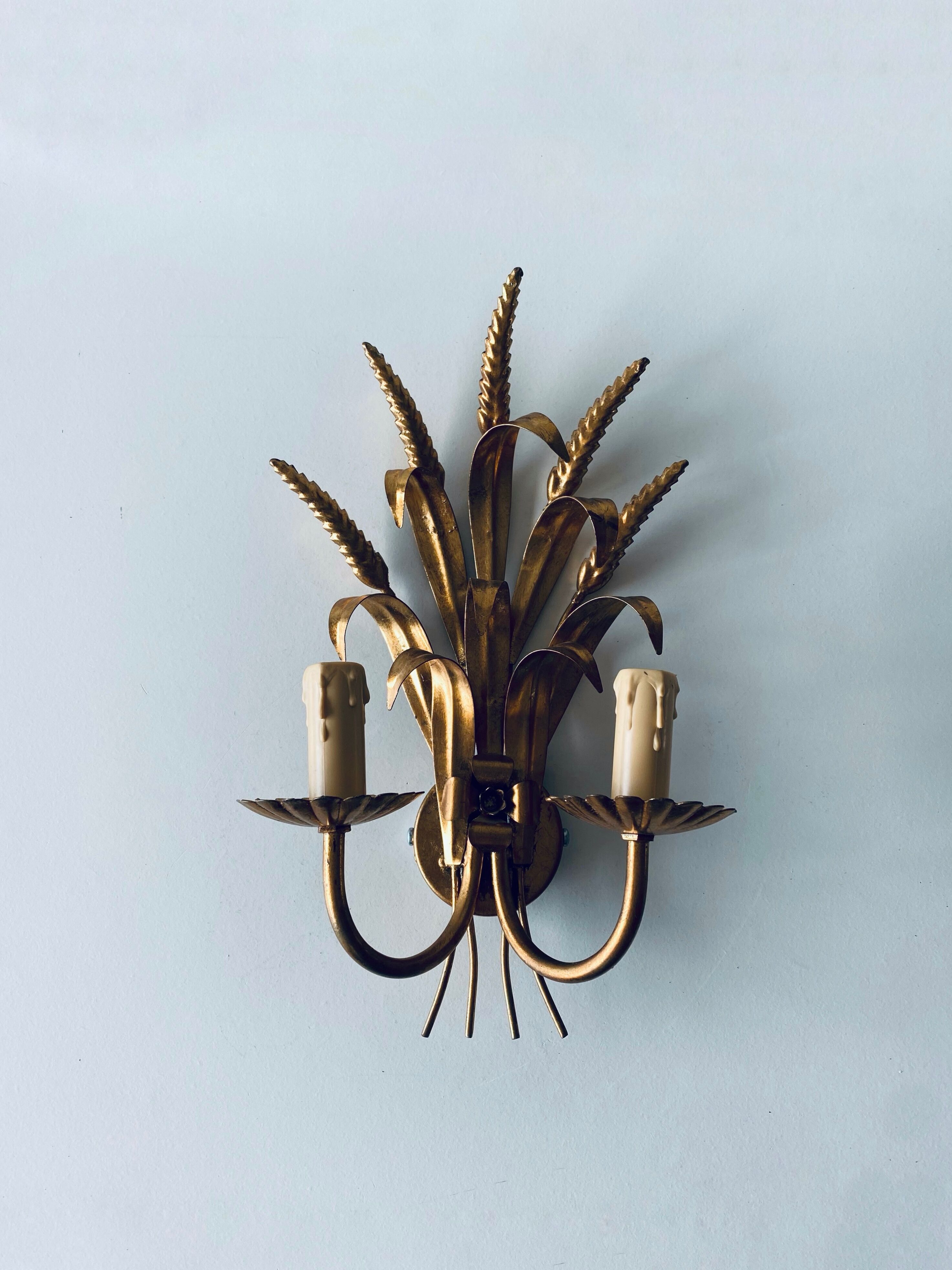 Double golden spike wall lamp