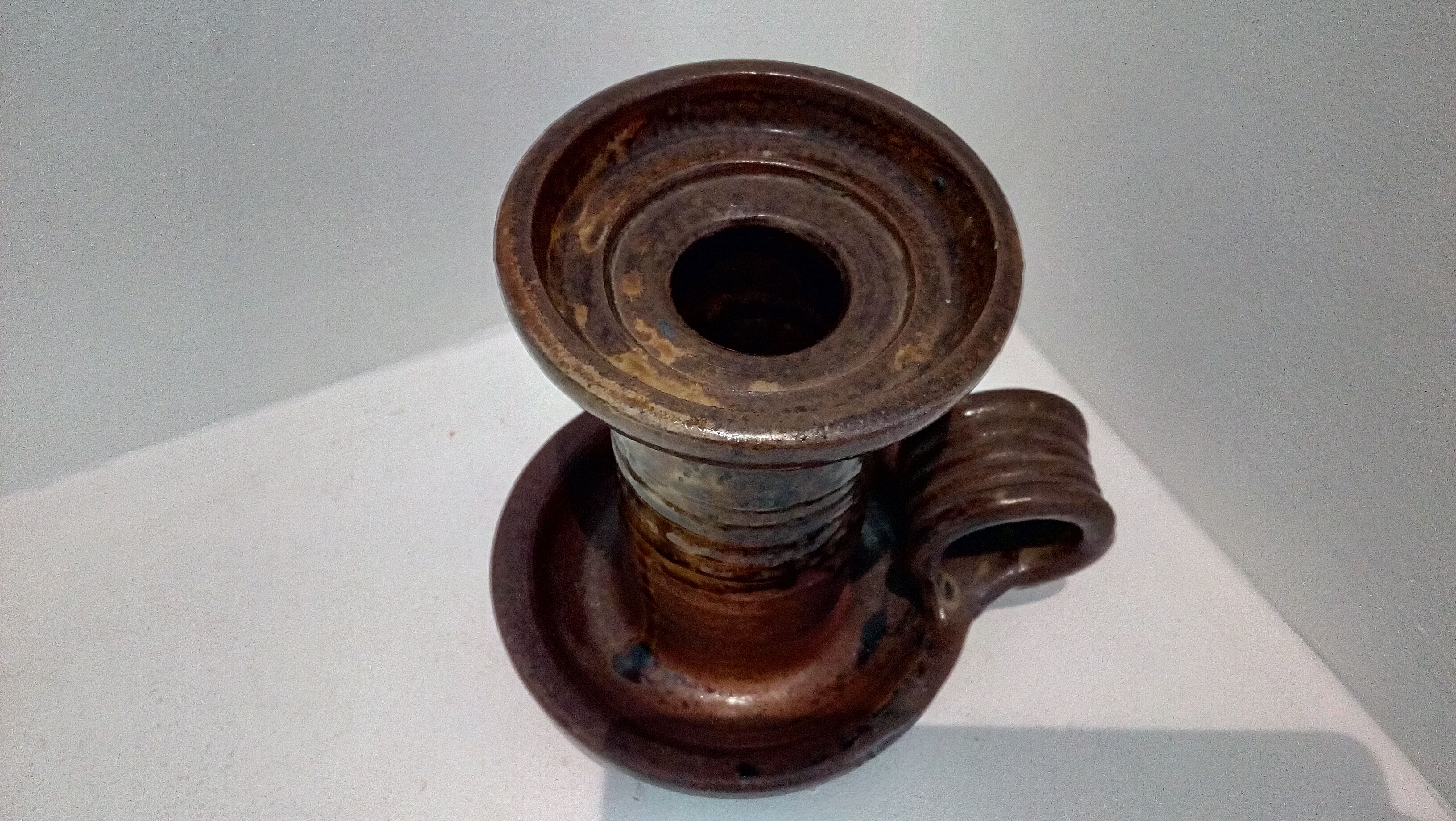 Signed sandstone candle holder