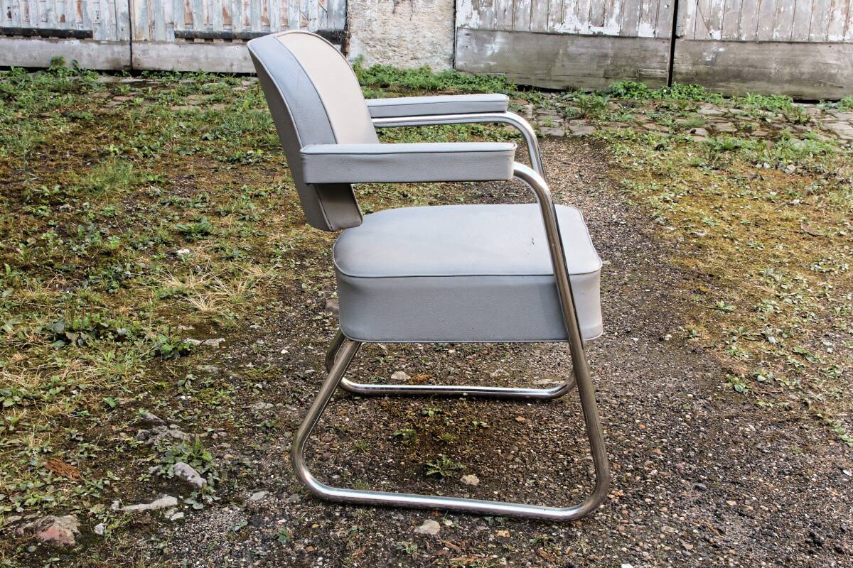 Set of 2 chairs and 1 armchair from the 70s in chrome metal and faux leather.