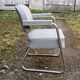 Set of 2 chairs and 1 armchair from the 70s in chrome metal and faux leather.