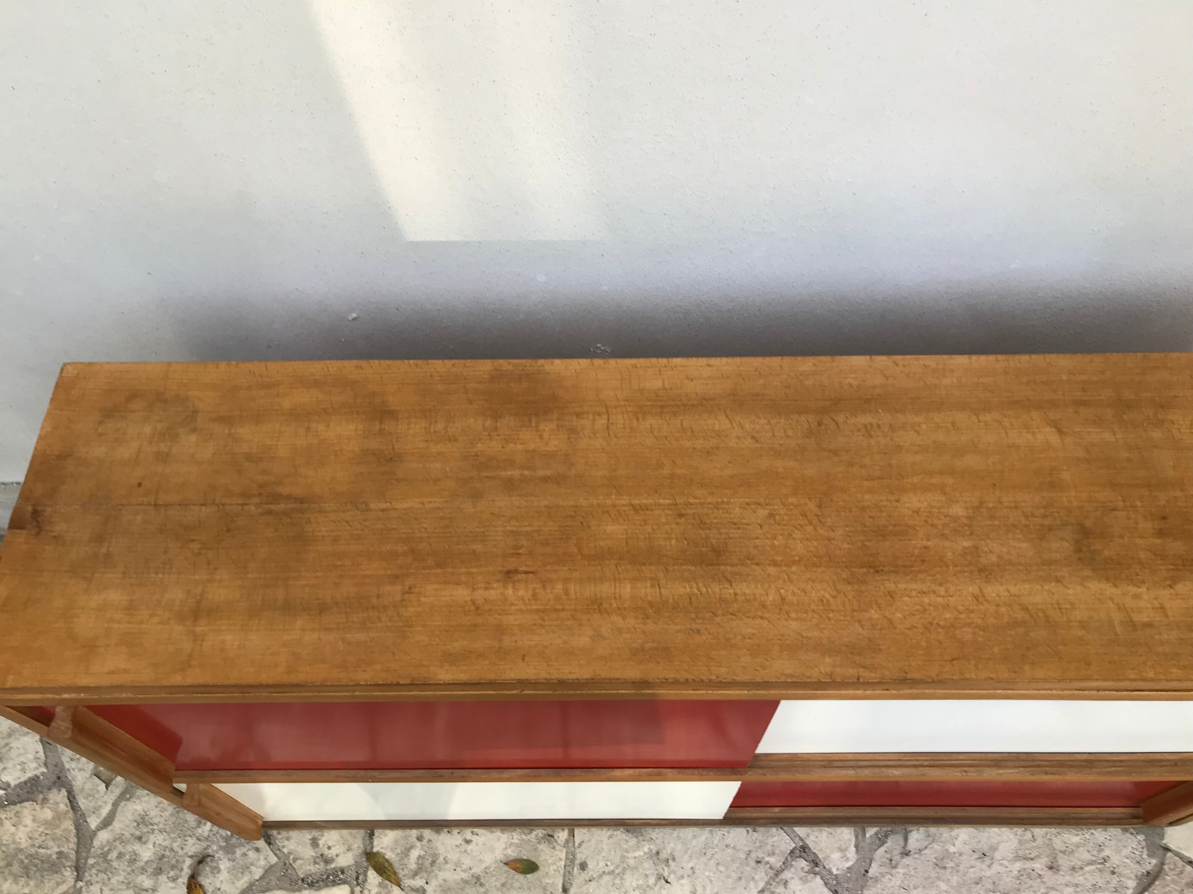 Storage cabinet with sliding doors circa 1950