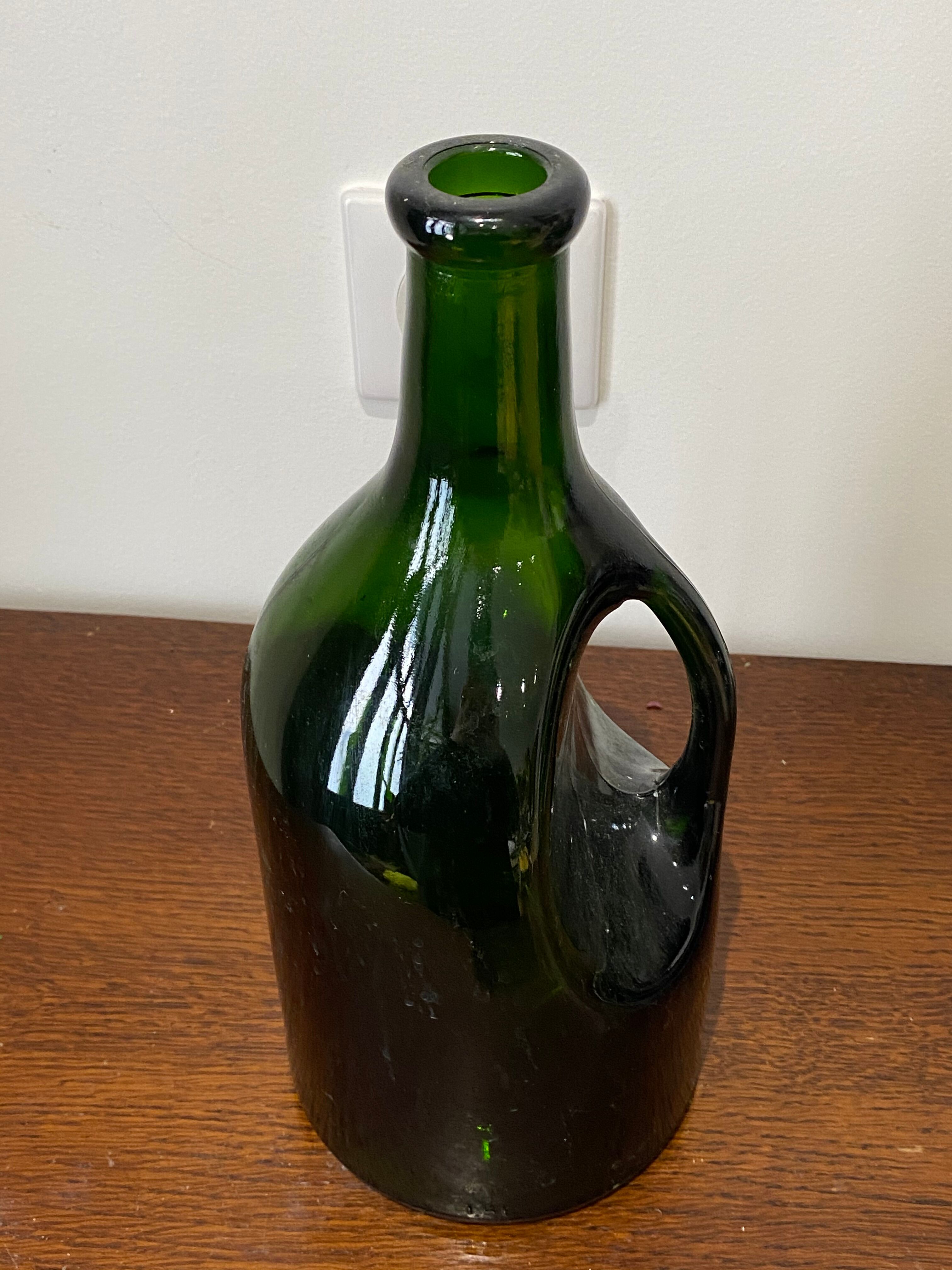Bottle in olive glass