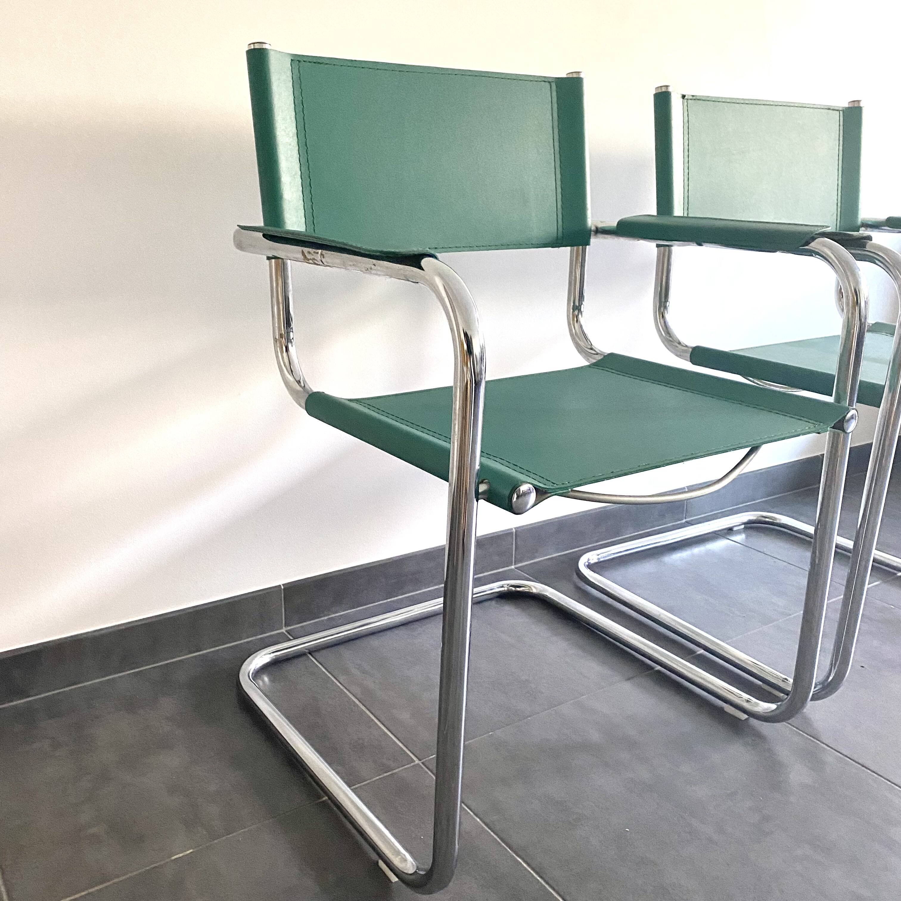 Pair of faux leather and chrome armchairs