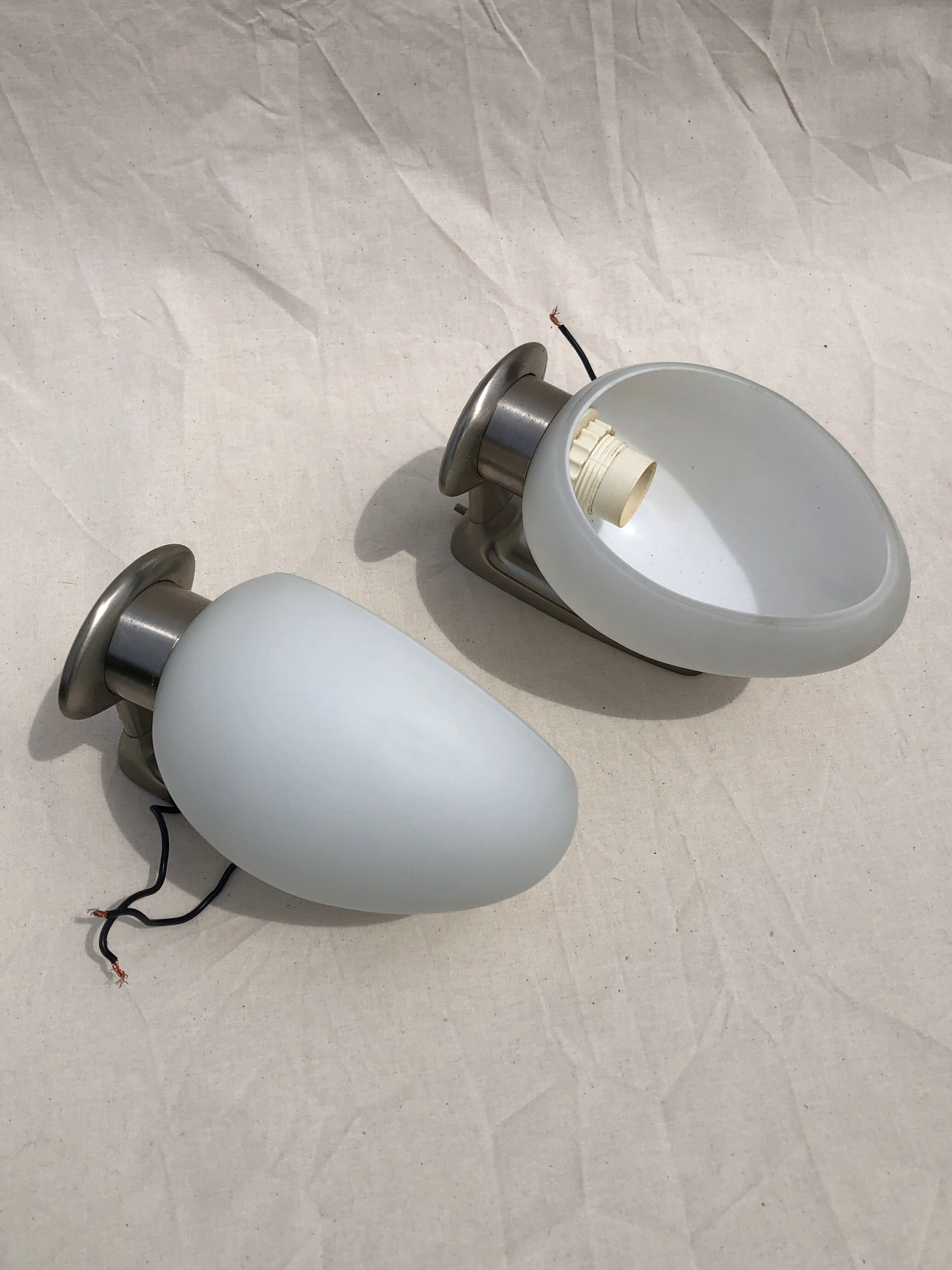 Pair of brushed steel appliques, half-egg opaline, 1970