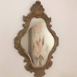 Bakelite scrolled mirror with rocaille pediment