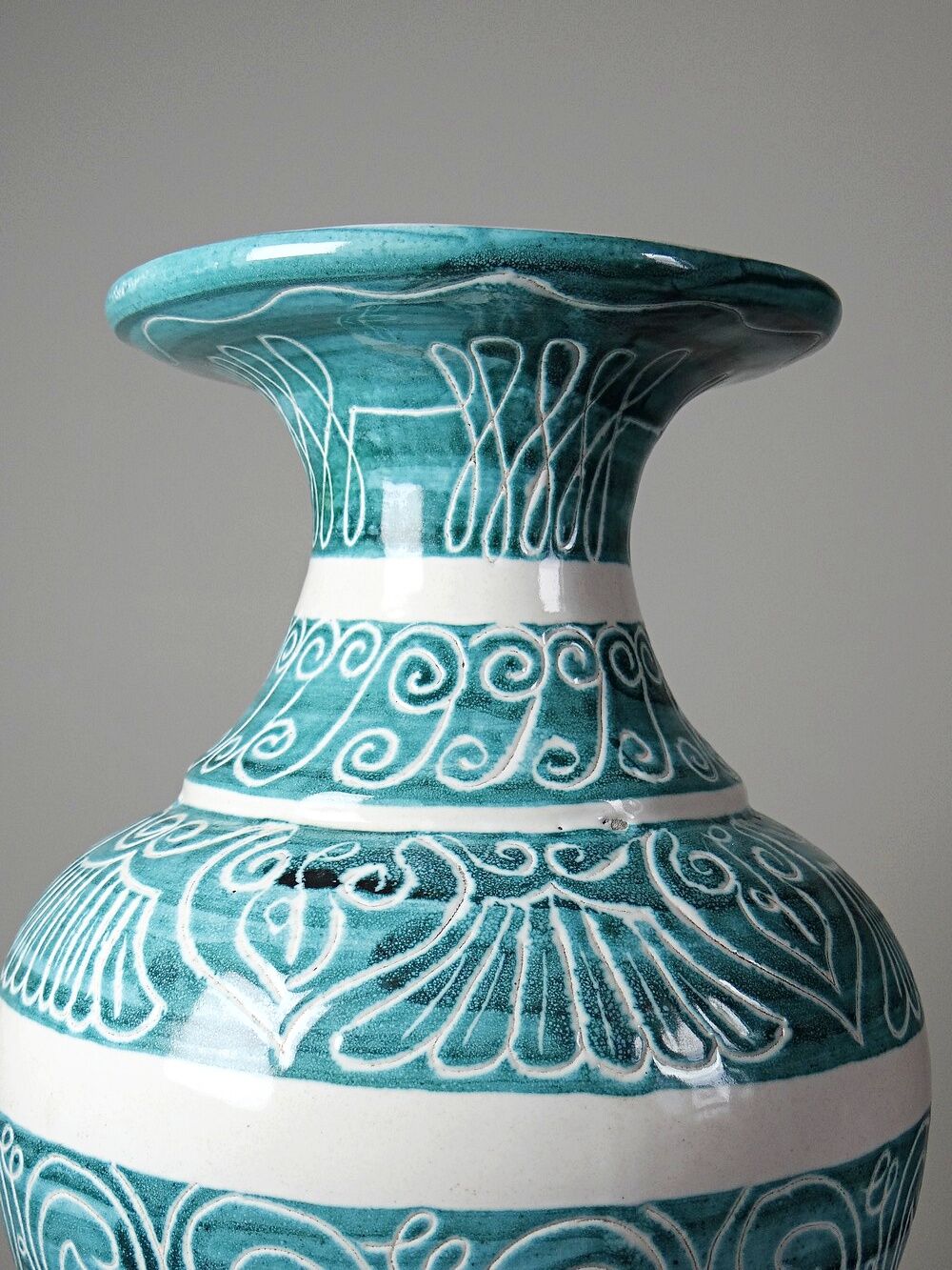 Vintage turquoise ceramic baluster vase with incised decoration.