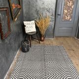 Romanian floral rug handwoven in wool, white and black background