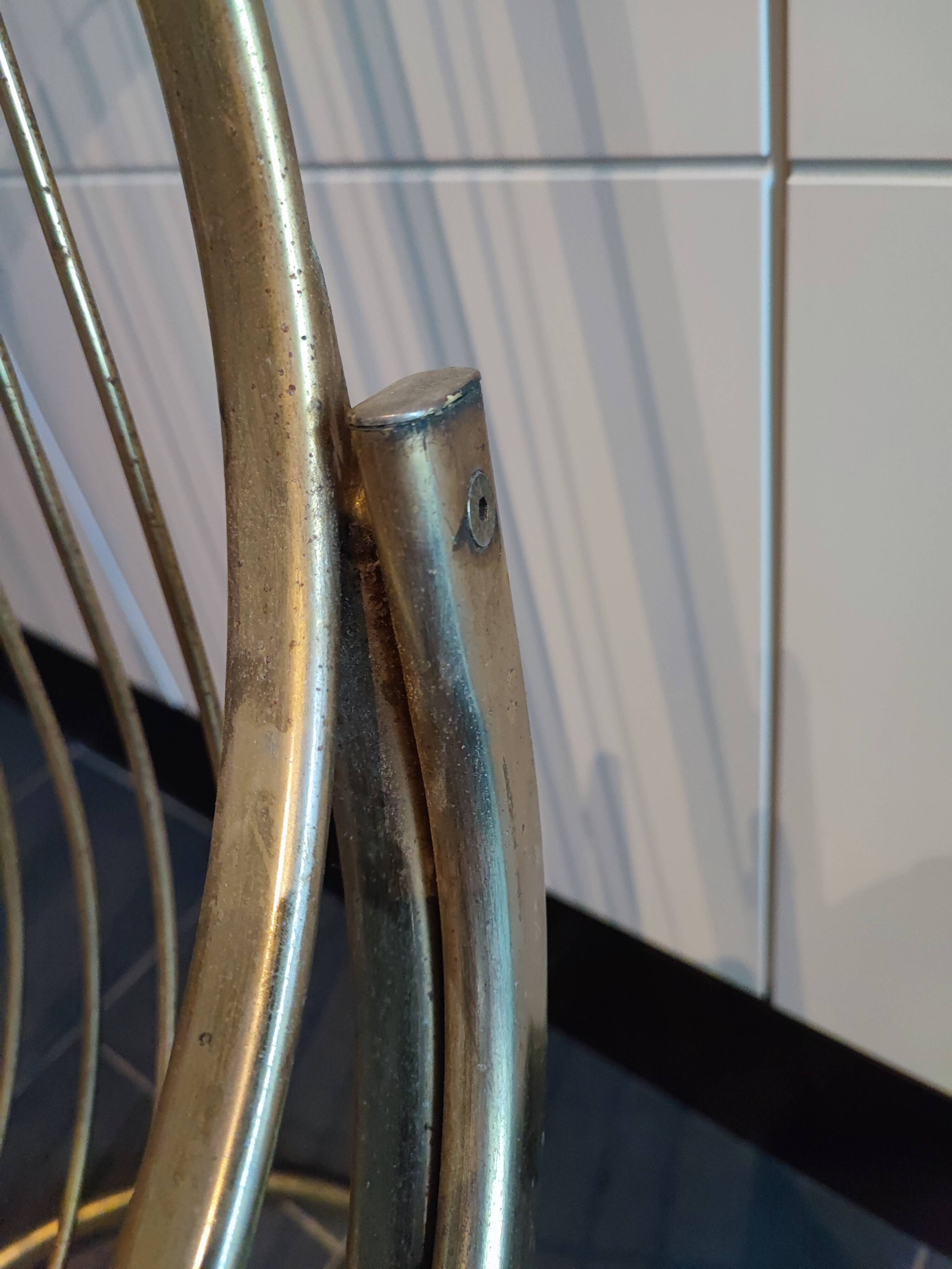 Tubular metal chair covered with gilding