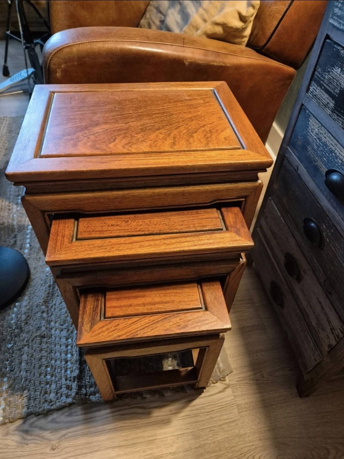 Stackable 3-piece nesting table in Asian teak wood with chinoiserie design.