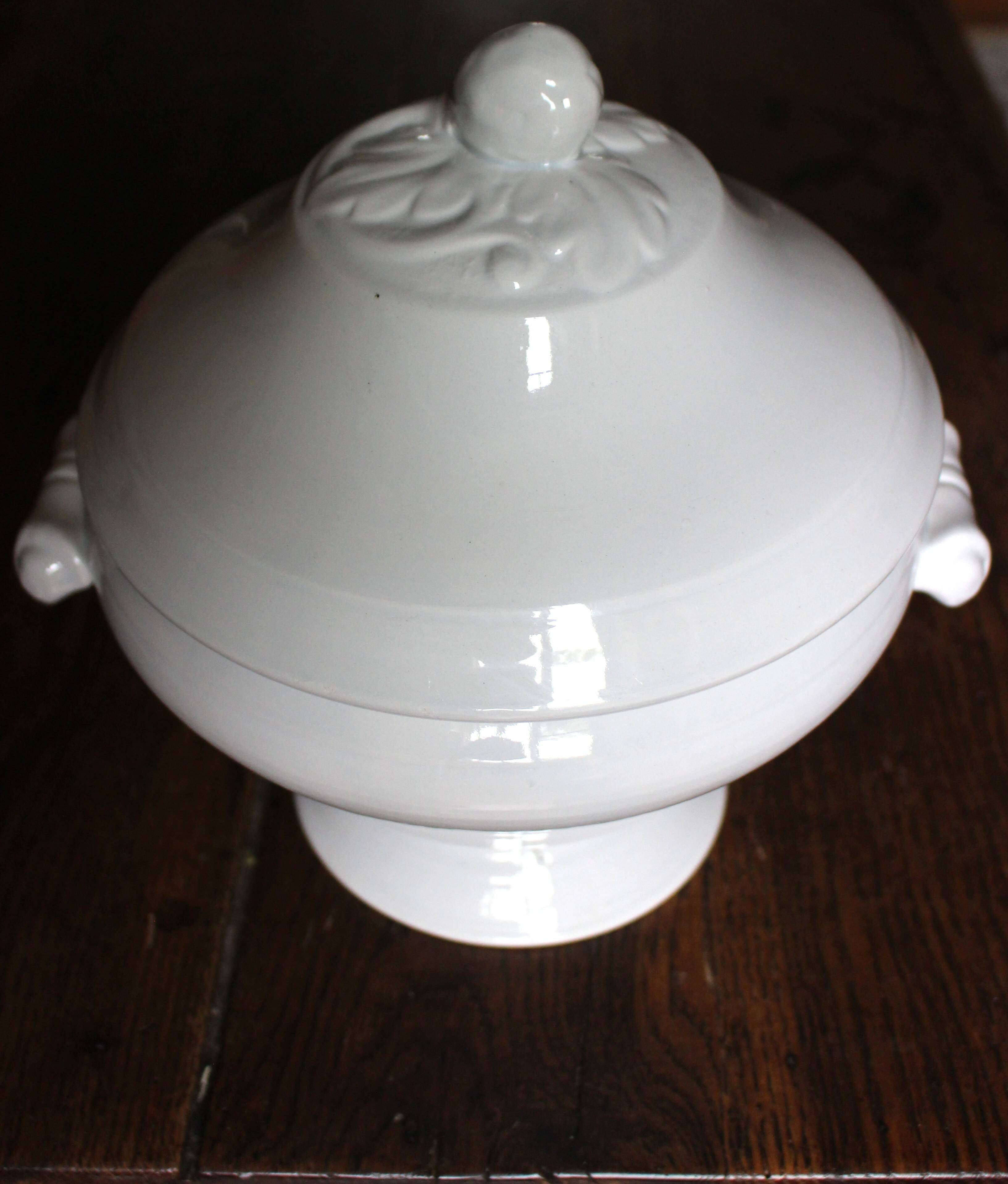 Antique soup tureen, white earthenware, with stopper decoration.