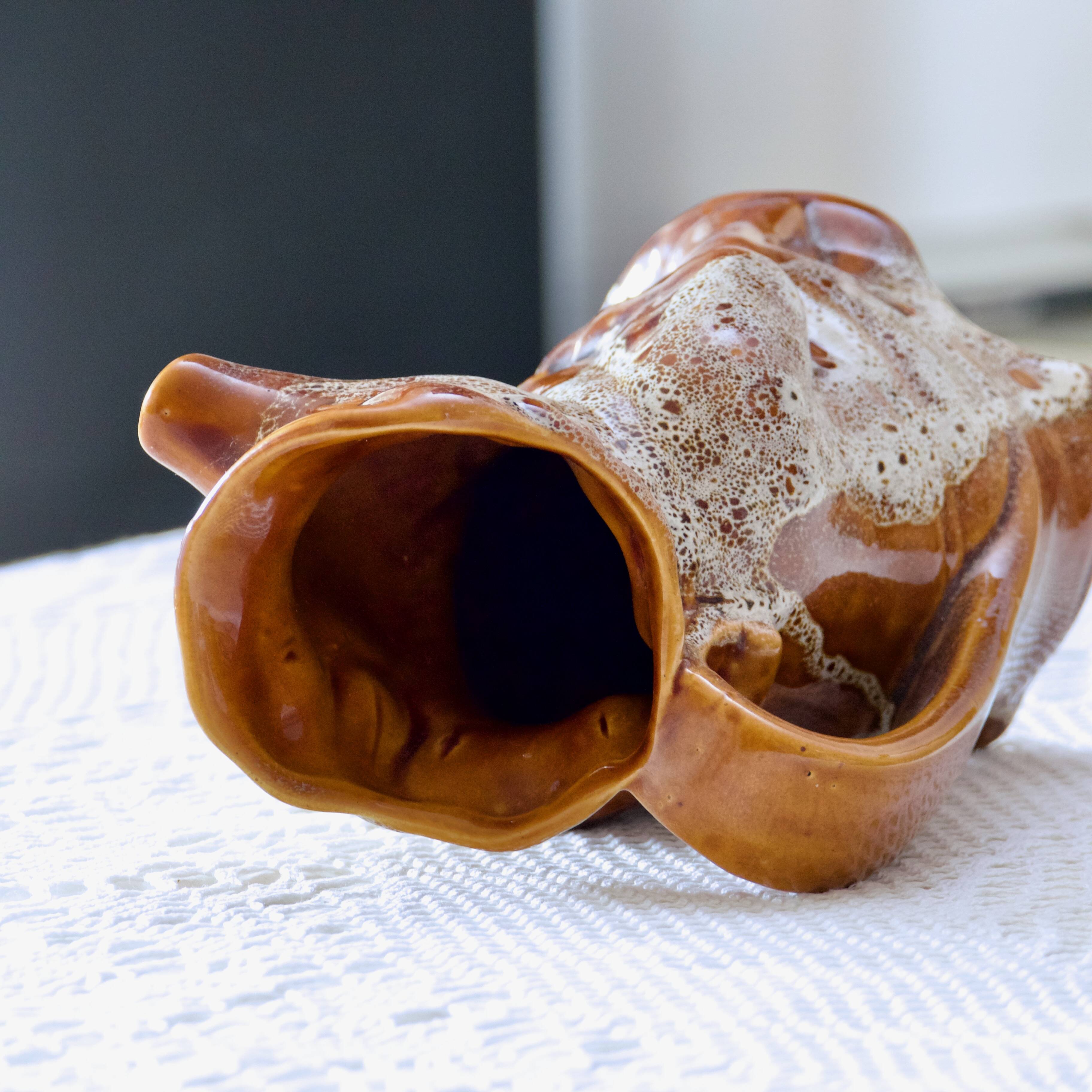 Antique zoomorphic pig carafe in foam-enameled stoneware