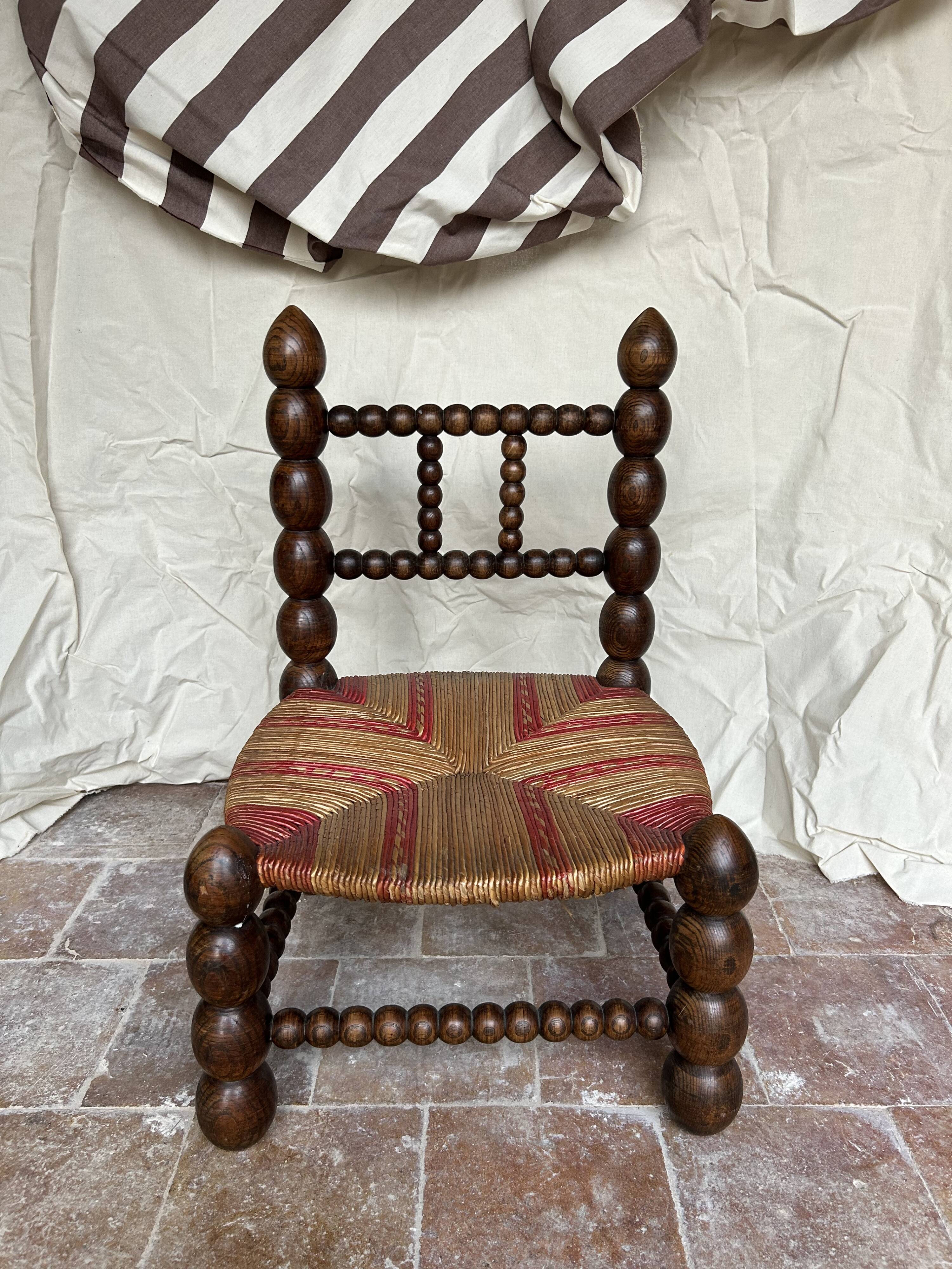 Turned wooden chair by Charles Dudouyt
