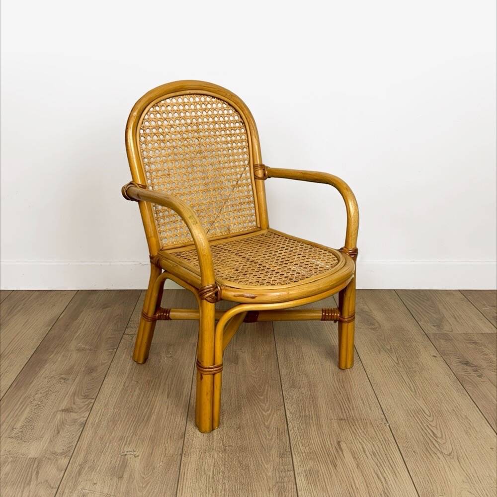 Child's armchair in rattan and caning from the 1960s.