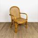 Child's armchair in rattan and caning from the 1960s.