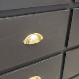 One-door workshop unit with eight black and gold drawers