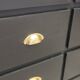 One-door workshop unit with eight black and gold drawers