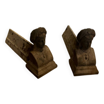 Pair of cast iron andirons with face