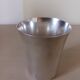 Silver-plated metal tumbler.