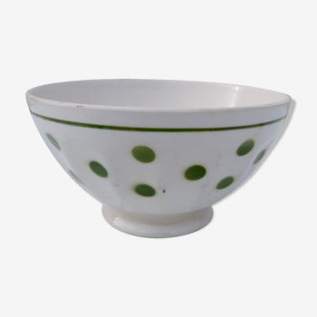 Ancient ceramic bowl with green polka dots