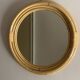 Round mirror from the 1960s with a frame made of rattan and metal.