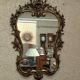 Gold metal wall mirror