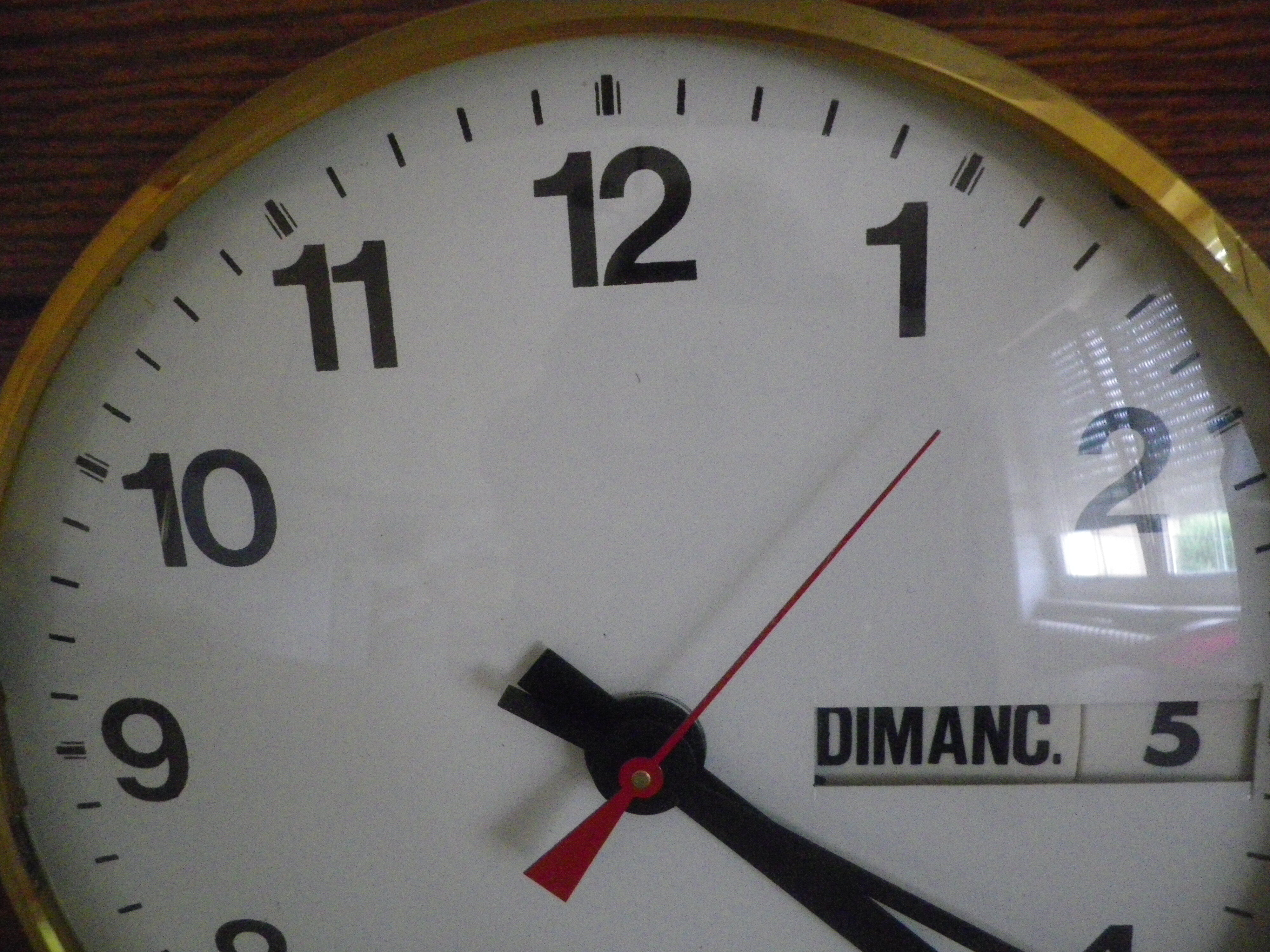 Formica wall clock with day and date - 1970s