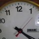 Formica wall clock with day and date - 1970s
