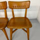 Set of 4 vintage solid oak chairs, 1960s design with sculpted backrest.